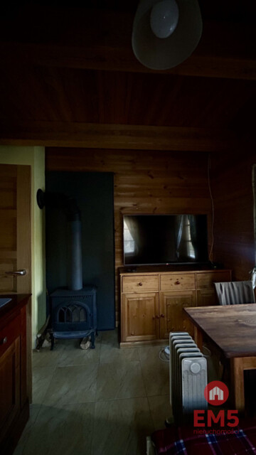 Drewniany dom z działką, sauną i garażem